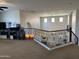 Spacious loft area overlooking the foyer, providing a versatile living space at 16401 S 29Th Dr, Phoenix, AZ 85045
