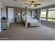 Luxurious main bedroom with a four-poster bed, mountain views, and neutral décor at 16401 S 29Th Dr, Phoenix, AZ 85045