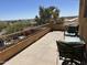 Covered patio with chairs, a table, a railing, and an exterior view at 16401 S 29Th Dr, Phoenix, AZ 85045