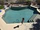 Aerial view of an in-ground pool featuring stone accents and a charming umbrella at 16401 S 29Th Dr, Phoenix, AZ 85045