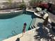 Inviting backyard pool with comfortable seating and lush landscaping perfect for outdoor relaxation at 16401 S 29Th Dr, Phoenix, AZ 85045