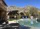 Resort-style pool area with a tiki hut, basketball court, and mountain views at 16401 S 29Th Dr, Phoenix, AZ 85045