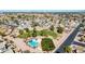 Aerial view of a community pool with lush greenery, offering a serene retreat in a vibrant neighborhood at 1705 E Juanita Ave, Mesa, AZ 85204