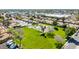 Aerial view of a suburban neighborhood highlighting a green community park with a pool and playground at 1705 E Juanita Ave, Mesa, AZ 85204