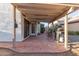 Covered back patio with rocking chairs and gas grill at 1705 E Juanita Ave, Mesa, AZ 85204