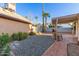 Backyard featuring desert landscaping and covered patio area at 1705 E Juanita Ave, Mesa, AZ 85204