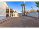 Backyard with desert landscaping, patio, and palm trees at 1705 E Juanita Ave, Mesa, AZ 85204