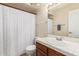 Bathroom with vanity and shower with patterned shower curtain at 1705 E Juanita Ave, Mesa, AZ 85204