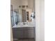 Bright bathroom with modern vanity, decorative lighting and updated fixtures at 1705 E Juanita Ave, Mesa, AZ 85204