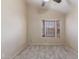 Bright and spacious bedroom with a large bay window, neutral walls, and plush carpeting at 1705 E Juanita Ave, Mesa, AZ 85204