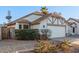 Charming single-story home featuring a two-car garage, landscaped yard, and inviting curb appeal at 1705 E Juanita Ave, Mesa, AZ 85204