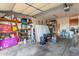 Spacious garage with workbench and storage shelves at 1705 E Juanita Ave, Mesa, AZ 85204
