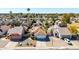 Charming single-Gathering home with a well-maintained lawn, complemented by mature trees and inviting landscaping at 1705 E Juanita Ave, Mesa, AZ 85204