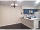 Charming kitchen features blue cabinets, a white countertop, and stainless steel appliances at 1705 E Juanita Ave, Mesa, AZ 85204