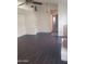 Spacious living area featuring wood-look floors and an open layout at 1705 E Juanita Ave, Mesa, AZ 85204