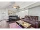 Inviting living room featuring vaulted ceilings, cozy sofas, and a stylish coffee table, perfect for relaxing and entertaining at 1705 E Juanita Ave, Mesa, AZ 85204