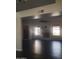 Spacious living room with fireplace, fan, and plenty of natural light at 1705 E Juanita Ave, Mesa, AZ 85204