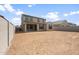 Large backyard with fresh dirt, offering a blank canvas for landscaping and outdoor living at 17614 W Palo Verde Dr, Litchfield Park, AZ 85340