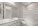Bright bathroom featuring a vanity with sink, mirror, toilet, and bathtub with shower at 17614 W Palo Verde Dr, Litchfield Park, AZ 85340
