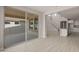 Bright living area with sliding glass doors leading to an outdoor patio and backyard at 17614 W Palo Verde Dr, Litchfield Park, AZ 85340