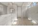A bright ensuite bathroom featuring a walk-in shower and dual sinks at 17614 W Palo Verde Dr, Litchfield Park, AZ 85340