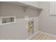 Close-up of the utility room hookups at 17614 W Palo Verde Dr, Litchfield Park, AZ 85340