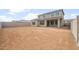 New home featuring a spacious dirt backyard and a covered patio at 17633 W Palo Verde Dr, Litchfield Park, AZ 85340