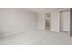 Spacious bedroom with neutral carpet and view to ensuite bathroom at 17633 W Palo Verde Dr, Litchfield Park, AZ 85340
