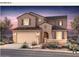 Charming two-story stucco home featuring a tiled roof and desert landscaping for relaxed outdoor living at 17633 W Palo Verde Dr, Litchfield Park, AZ 85340