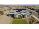 Single Gathering home with solar panels, three car garage, a well manicured lawn and close proximity to neighborhood at 17962 W Elm St, Goodyear, AZ 85395