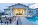 Relaxing backyard with a pool, covered patio, outdoor dining area, and cozy seating around a fire pit at 17962 W Elm St, Goodyear, AZ 85395