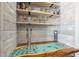 Custom bar area with built-in shelves and a unique epoxy countertop at 17962 W Elm St, Goodyear, AZ 85395