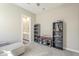 Bedroom area features shelves, storage, and a door leading to a bathroom at 17962 W Elm St, Goodyear, AZ 85395
