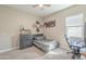 Cozy bedroom with carpet and a ceiling fan offers a comfortable and relaxing space at 17962 W Elm St, Goodyear, AZ 85395
