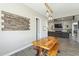 Rustic dining area features a custom wood table and pendant lighting at 17962 W Elm St, Goodyear, AZ 85395