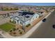 Inviting home showcasing a well-maintained lawn, stylish landscaping, a backyard fence, and solar panels at 17962 W Elm St, Goodyear, AZ 85395