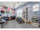 Tidy garage with epoxy flooring, shelving, overhead lighting, and ample workspace at 17962 W Elm St, Goodyear, AZ 85395