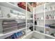 Well-organized linen closet with ample shelving for towels, blankets, and other household items at 17962 W Elm St, Goodyear, AZ 85395