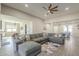 Spacious living room with open floor plan, tile floors, and neutral paint at 17962 W Elm St, Goodyear, AZ 85395