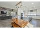 Open concept living space combining kitchen, dining, and living areas for seamless entertaining at 17962 W Elm St, Goodyear, AZ 85395