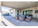Outdoor patio offering a cozy seating area with a gas fire pit and ceiling lights at 17962 W Elm St, Goodyear, AZ 85395