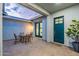 Charming outdoor patio with stylish seating, brick pavers, and a tranquil ambiance at 17962 W Elm St, Goodyear, AZ 85395