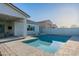 Sparkling pool with a patio area, lounge chairs, and a covered outdoor area at 17962 W Elm St, Goodyear, AZ 85395