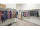 Spacious walk-in closet features ample storage space and custom shelving for clothing and accessories at 17962 W Elm St, Goodyear, AZ 85395