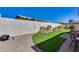 Spacious backyard featuring manicured lawn and flower bed areas, providing a serene outdoor space at 17988 W Deneen Way, Surprise, AZ 85374