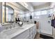 Bathroom featuring a double vanity with lots of counterspace and a glass shower for a luxurious experience at 17988 W Deneen Way, Surprise, AZ 85374