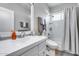 Bright bathroom with a single vanity and a shower-tub combination and neutral tones to complete the space at 17988 W Deneen Way, Surprise, AZ 85374