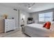 Bright bedroom with ensuite bathroom, a comfortable bed and plenty of natural light creates a serene retreat at 17988 W Deneen Way, Surprise, AZ 85374