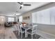 Open-concept dining room features a modern table set and lots of natural light at 17988 W Deneen Way, Surprise, AZ 85374