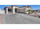 Charming home showcasing desert landscaping, a concrete driveway, and an inviting covered porch at 17988 W Deneen Way, Surprise, AZ 85374